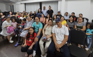 Members of the Filipino community join Consul Barbie Rosales and Honorary Consul Keith Russell for a family photo after the town hall meeting held on 30 April 2025.